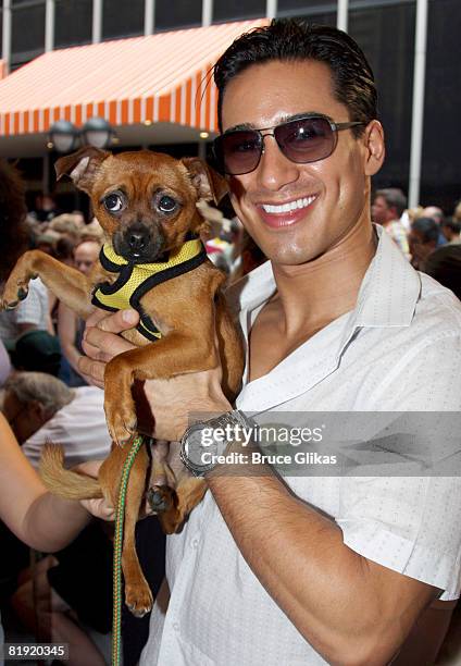 Mario Lopes and "Skeet" pose at Broadway Barks 10 in Shubert Alley on July 12, 2008 in New York City.