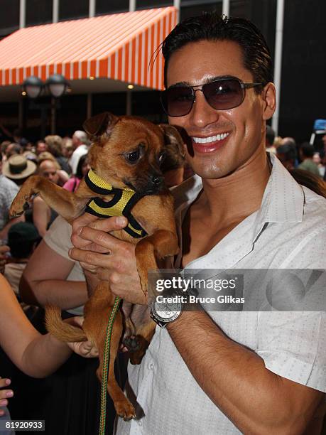 Mario Lopez and "Skeet" pose at Broadway Barks 10 in Shubert Alley on July 12, 2008 in New York City.