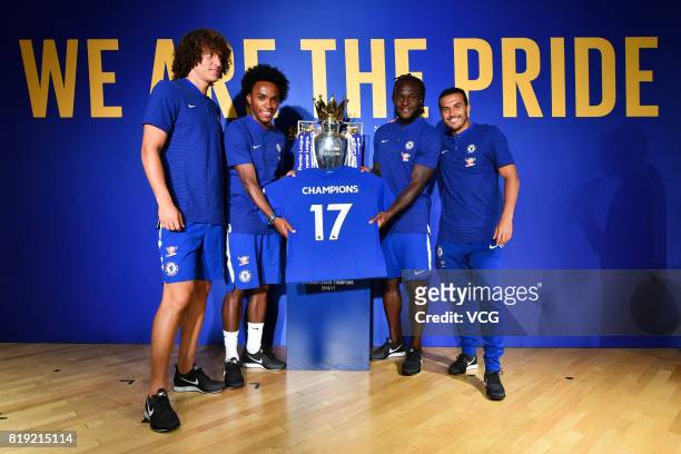 David Luiz, Willian, Victor Moses and Pedro of Chelsea FC pose with the Premier League trophy during an activity ahead of the Pre-Season Friendly...