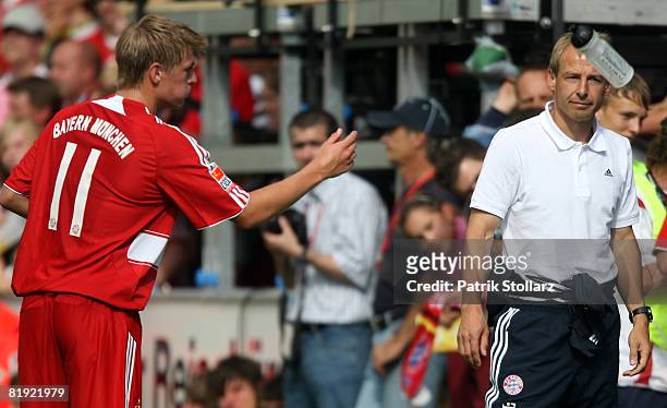 Toni Kroos of Munich throws a bottle during a friendly match between SV Lippstadt 08 and FC Bayern Munich at the 'Am Waldschloesschen' stadium on...