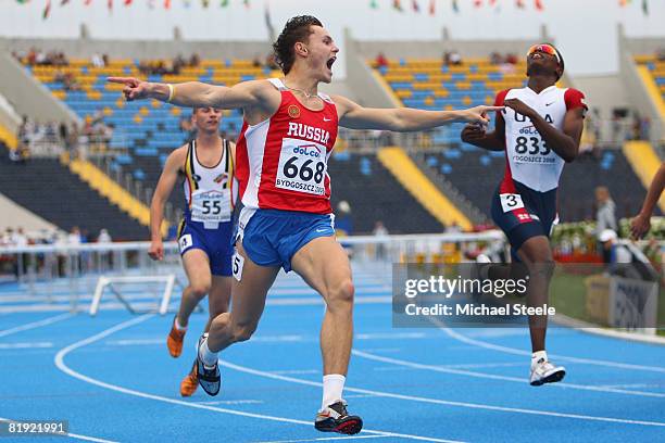 Konstantin Shabanov of Russia celebrates winning gold in the men's 110m hurdles from Booker Nunley of USA during day six of the 12th IAAF World...