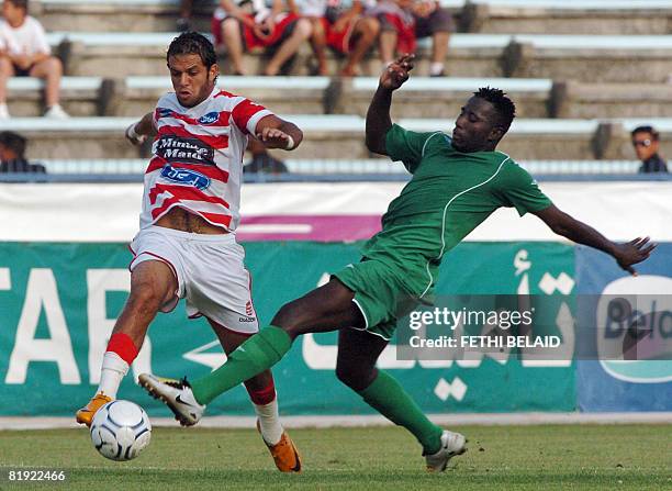 Tunisia's Club Africain striker Borhane Ghanem vies with Mali's Djoliba AC forward Fane Lassana during an African Cup Confederation football match on...