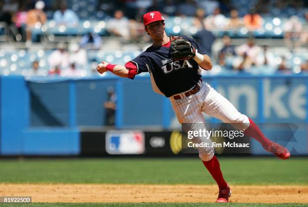 Jason Donald of the Philadelphia Phillies and playing for the United States Olympic Team throws to first against the World Futures Team during the...