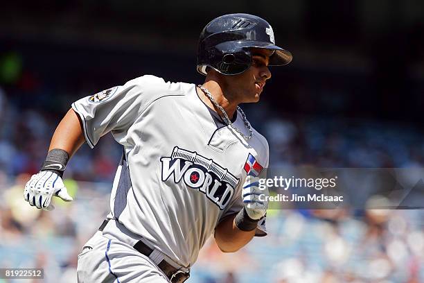 Fernando Martinez of the New York Mets and playing for World Futures Team runs to first against the United States Olympic Team during the 2008 XM...