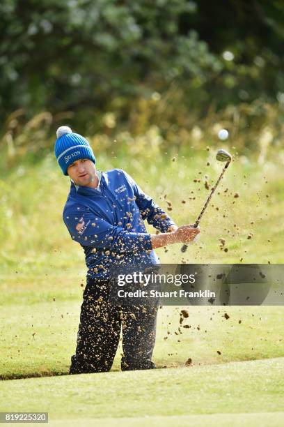 Russell Knox of Scotland hits a bunker shot on the 5th hole during the first round of the 146th Open Championship at Royal Birkdale on July 20, 2017...