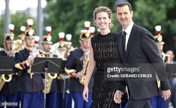 Syrian President Bashar al-Assad and his wife Asma al-Assad arrive for a diner at the Petit Palais, after attending Paris' Union for the...