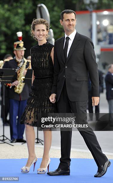 Syrian President Bashar al-Assad and his wife Asma al-Assad arrive for a diner at the Petit Palais, after attending Paris' Union for the...