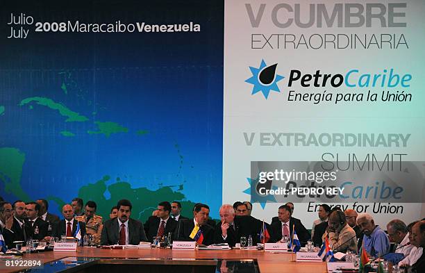 Venezuela's President Hugo Chavez speaks with his Minister of Energy and President of the state-owned oil company PDVSA Rafael Ramirez on July 13,...
