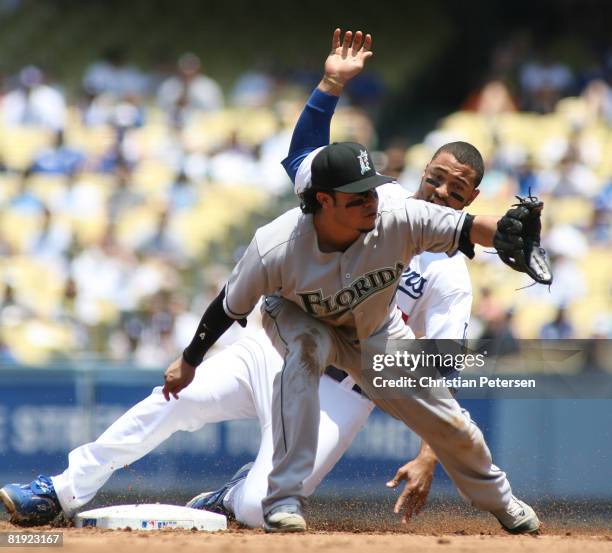 Matt Kemp of the Los Angeles Dodgers steals second base against Alfredo Amezaga in the first inning during the game against the Florida Marlins at...