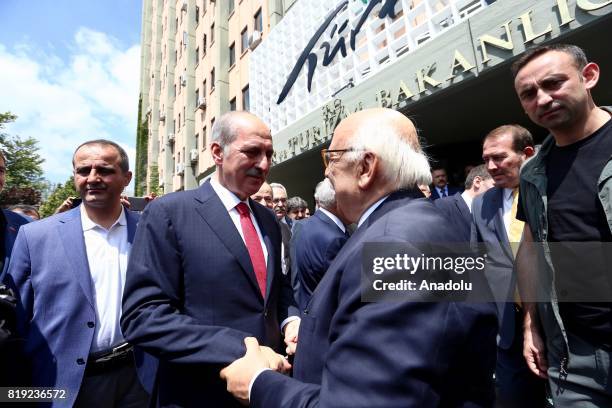 Turkey's new Culture and Tourism Minister Numan Kurtulmus takes over his new post from Nabi Avci during a handover ceremony following Turkish Cabinet...