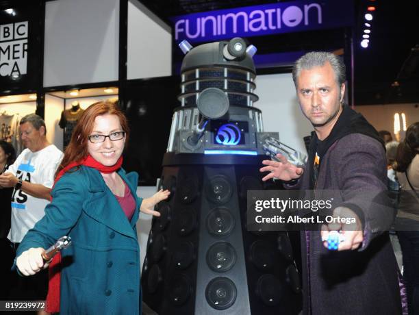 Cosplayer Nathaniel J. Peinado dressed as Doctor Who posig with a Dalek attends Comic-Con International 2017 - Preview Night held at San Diego...