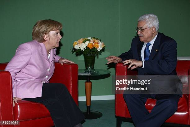 In this handout image provided by the Palestinian Press Office, German chancellor Angela Merkel meets with Palestinian President Mahmoud Abbas at the...