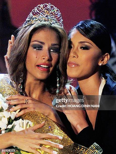 Newly crowned Miss Universe 2008 Dayana Mendoza, Miss Venezuela cries as she is hugged by Miss Universe 2007 Miory Mori at the final of the 57th Miss...