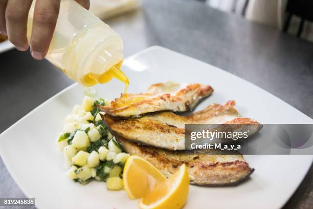 served roasted trout with side dish - boiled potato imagens e fotografias de stock