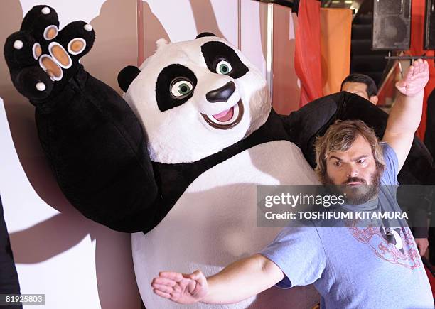 Actor Jack Black poses with movie charactor "Po" during a photo session for the film "Kung Fu Panda" in Tokyo on July 14, 2008. The Kung Fu animation...