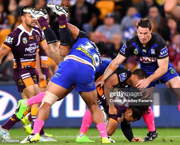 Adam Blair of the Broncos is lifted in the tackle by Danny Fualalo of the Bulldogs during the round 20 NRL match between the Brisbane Broncos and the...