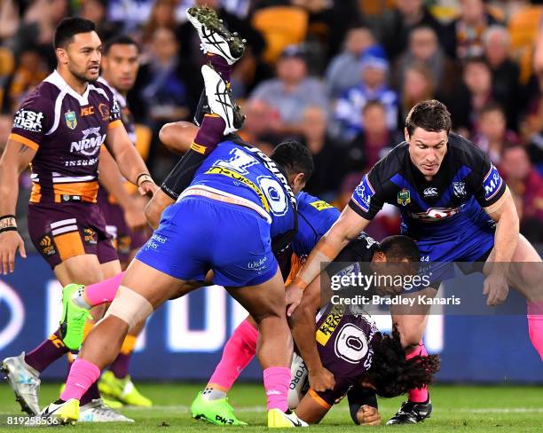 Adam Blair of the Broncos is lifted in the tackle by Danny Fualalo of the Bulldogs during the round 20 NRL match between the Brisbane Broncos and the...