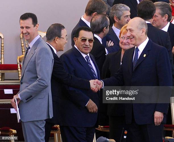 In this handout photo provided by the Israeli Government Press Office , guest of honor United Nations Secretary General Ban Ki-moon greets Egyptian...