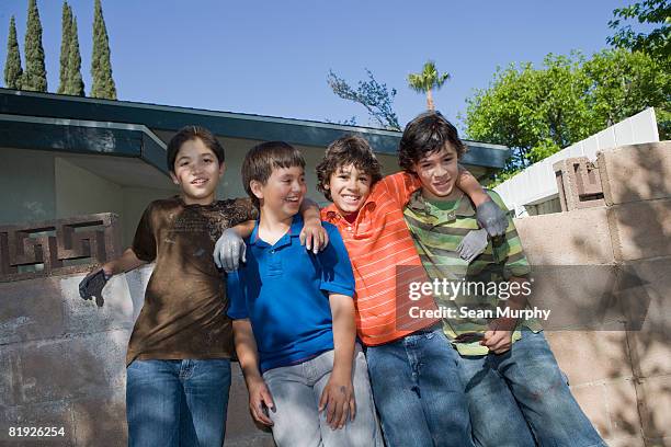 a group of four young boys - only boys stock pictures, royalty-free photos & images