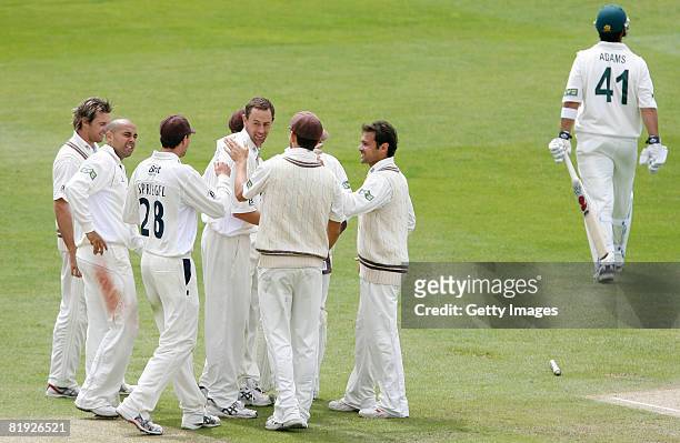 Surrey bowler Matthew Nicholson celebrates his wicket of Nottinghamshire's Andre Adams with teammates during the LV County Championship Division One...