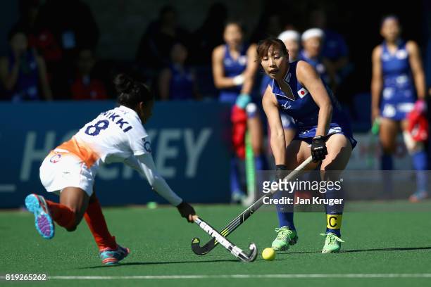 Yukari Mano of Japan and Nikki Pradhan of India battle for possession during the 5th-8th Place playoff match between India and Japan during Day 7 of...