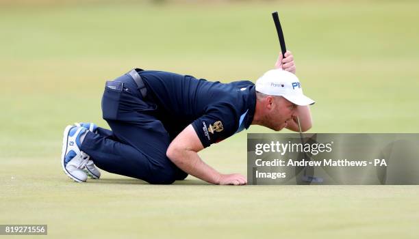 England's Adam Hodkinson lines up a putt on the 1st during day one of The Open Championship 2017 at Royal Birkdale Golf Club, Southport.