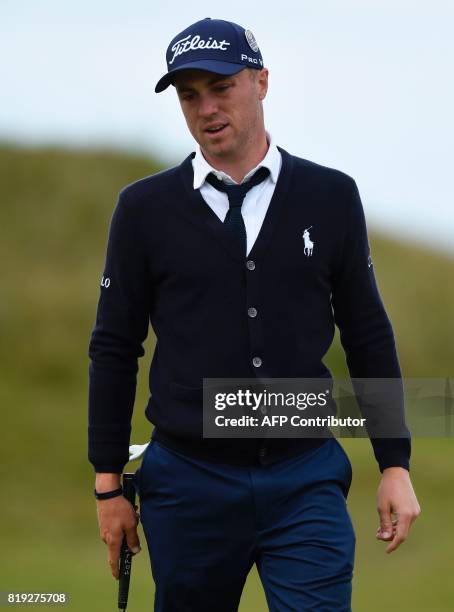 Golfer Justin Thomas reacts after putting on the 3rd green during his opening round on the first day of the Open Golf Championship at Royal Birkdale...
