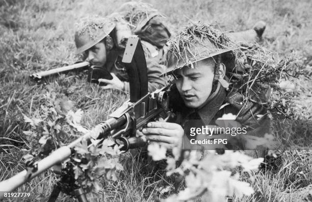 Czechoslavak Bren gunners complete a training exercise in Britain during World War II, circa 1940. The Bren gun was adapted in Britain from a Czech...