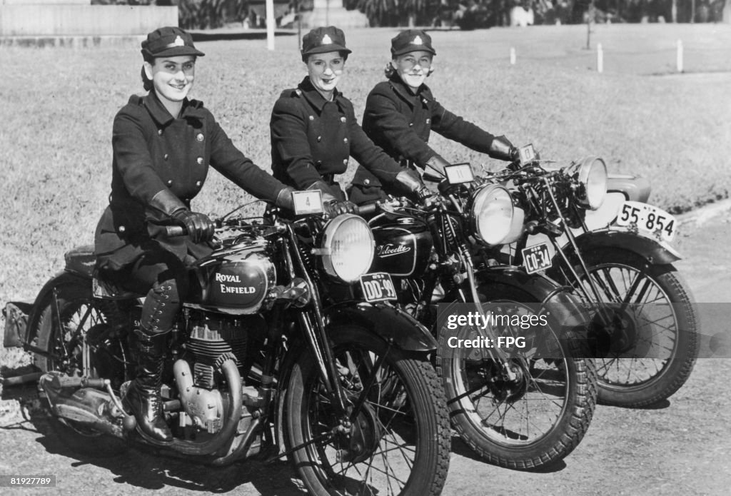 Three female motorcycle messengers of the National Emergency Services ...