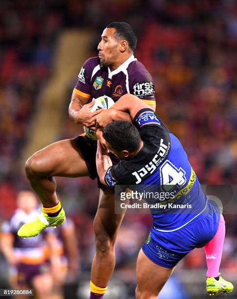 Tautau Moga of the Broncos gets above Chris Stanley of the Bulldogs as they compete for the ball during the round 20 NRL match between the Brisbane...