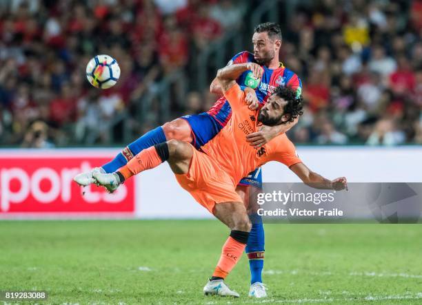 Liverpool FC forward Mohamed Salah fights for the ball with Crystal Palace defender Damien Delaney during the Premier League Asia Trophy match...