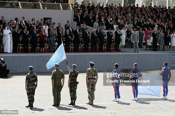 United Nations blue beret soldiers parade in front of heads of State and government during the Bastille Day military parade on the Champs Elysees on...