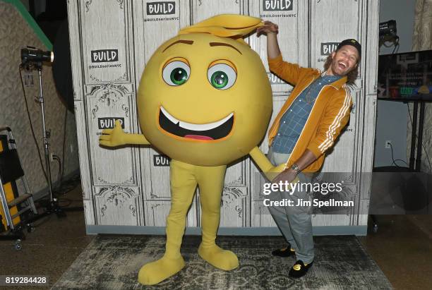 Actor TJ Miller an Gene the emoji attend Build to discuss their new movie "The Emoji Movie" at Build Studio on July 19, 2017 in New York City.