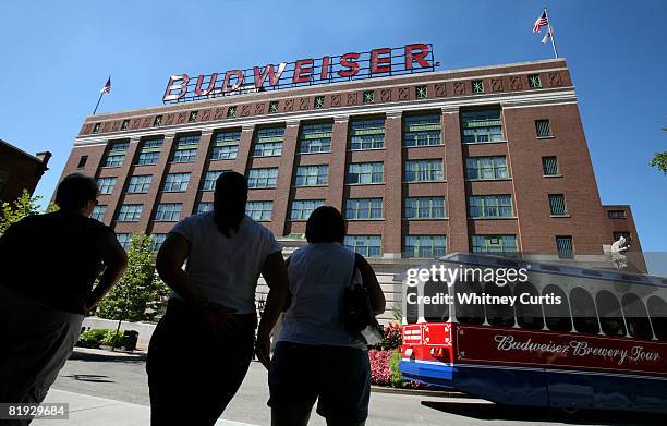 Visitors stand in front of the packaging plant for Anheuser-Busch Cos. July 14, 2008 in St. Louis, Missouri. Anheuser-Busch Cos. Inc.'s board of...