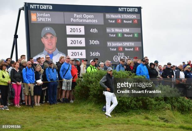 Jordan Spieth of the United States stands next to a scoreboard during the first round of the 146th Open Championship at Royal Birkdale on July 20,...