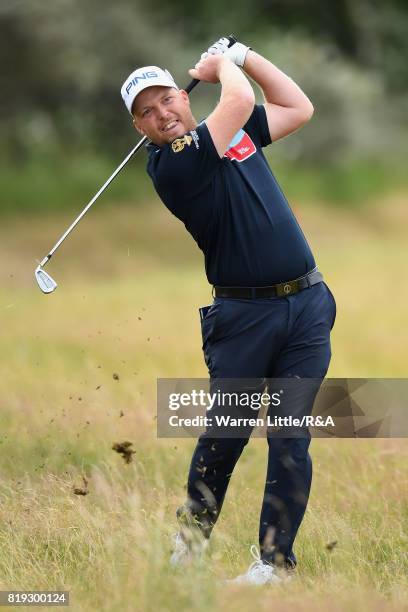 Adam Hodkinson of England hits his second shot on the 1st hole during the first round of the 146th Open Championship at Royal Birkdale on July 20,...