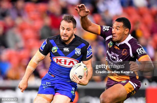 Josh Reynolds of the Bulldogs breaks away from the defence during the round 20 NRL match between the Brisbane Broncos and the Canterbury Bulldogs at...