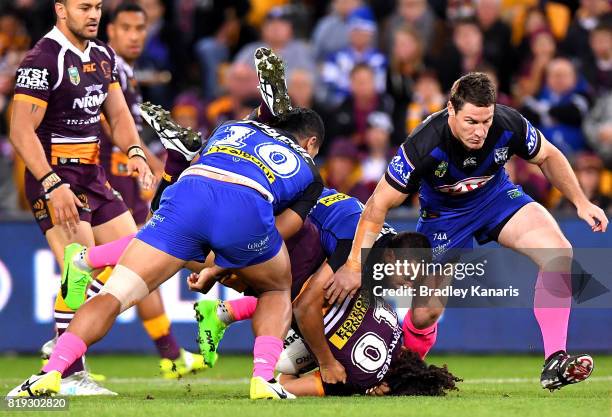 Adam Blair of the Broncos is lifted in the tackle by Danny Fualalo of the Bulldogs during the round 20 NRL match between the Brisbane Broncos and the...