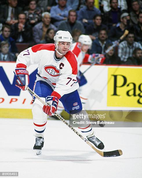 Pierre Turgeon of the Montreal Canadiens looks to make pass in game against the Boston Bruins at the Bell Center.
