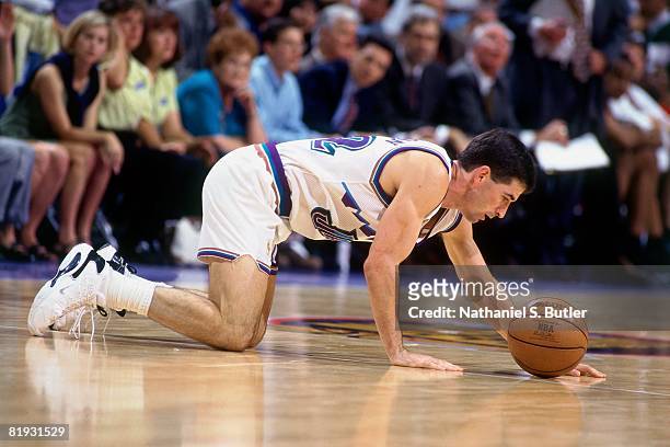 John Stockton of the Utah Jazz shows fatigue in Game Five of the 1997 NBA Finals against the Chicago Bulls at the Delta Center on June 11, 1997 in...
