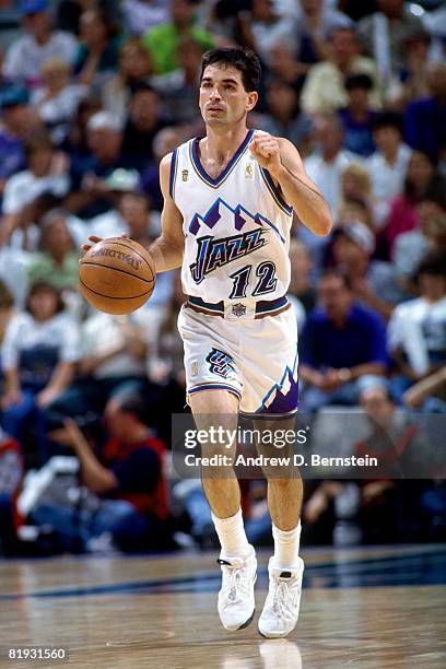 John Stockton of the Utah Jazz moves the ball up court in Game Three of the 1997 NBA Finals against the Chicago Bulls at the Delta Center on June 6,...