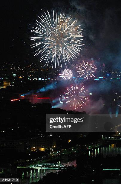 Fireworks explode over the Trocadero behind the Eiffel Tower during the traditional celebration of Bastille Day on July 14, 2008 in Paris. France...