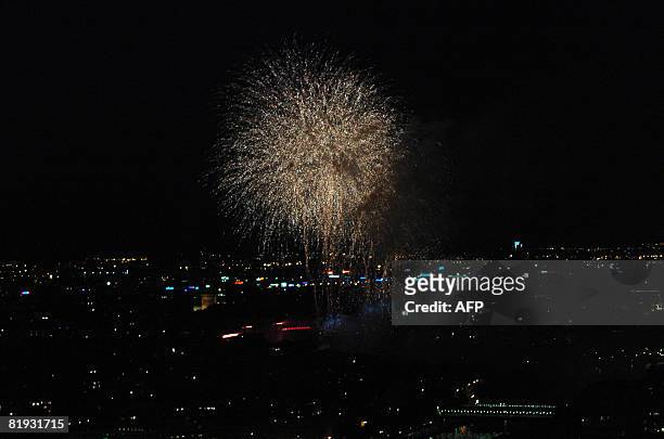 Fireworks explode over the Trocadero behind the Eiffel Tower during the traditional celebration of Bastille Day on July 14, 2008 in Paris. France...