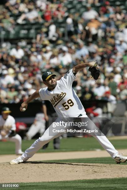 Andrew Brown of the Oakland Athletics pitches during the game against the Los Angeles Angels at McAfee Coliseum in Oakland, California on June 8,...