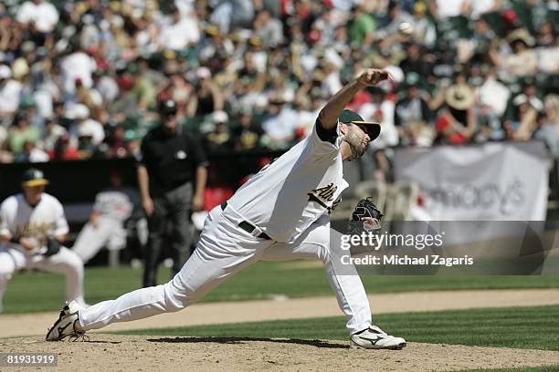 Andrew Brown of the Oakland Athletics pitches during the game against the Los Angeles Angels at McAfee Coliseum in Oakland, California on June 8,...