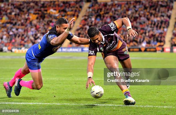 Jonus Pearson of the Broncos drops the ball over the line as he attempts to score a try during the round 20 NRL match between the Brisbane Broncos...