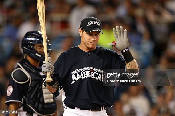 Josh Hamilton of the Texas Rangers reacts almost hitting the photographers with a foul ball during the 2008 MLB All-Star State Farm Home Run Derby at...