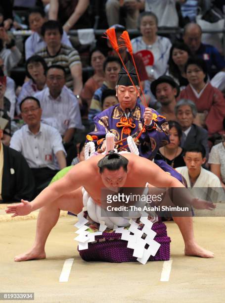 Mongolian yokozuna Hakuho performs the 'Dohyo-iri' ring purification ritual during day twelve of the Grand Sumo Nagoya Torunament at Aichi Prefecture...