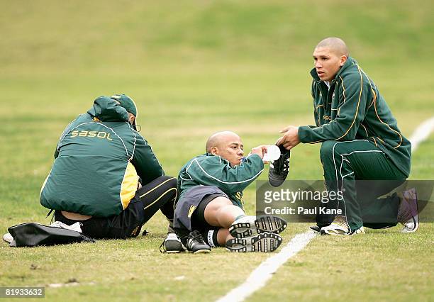 Bolla Conradie and Ricky Januarie of the Springboks relax after a South African Springboks training session at Colins Oval on July 15, 2008 in Perth,...