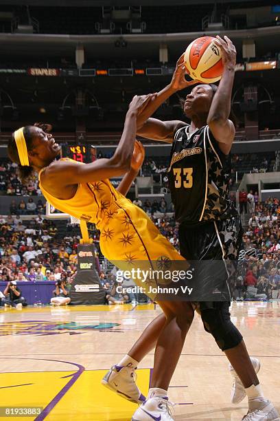 Sophia Young of the San Antonio Silver Stars collides with Delisha Milton-Jones of the Los Angeles Sparks during their game on July 14, 2008 at...